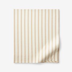 a white and brown striped napkin on top of a table