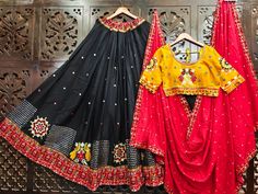 This beautiful festive ensemble comprises of a  Yellow  blouse, a Red Dupatta and Beautiful Black Lehenga. Embellished with Gamhti Work, Gujrati Border and golden border. Pure cotton gamthi work chaniya choli   6-7 meter flair  Fancy Patola  print skirt  42 waist  42 length  L size blouse with margin  With hooks  Please note the we offer expediate shipping, that only speeds up the shipping time, our processing time will not be effected. Red Mirror Work Anarkali For Traditional Ceremonies, Traditional Party Lehenga With Motifs, Wedding Sharara With Motifs, Wedding Sharara With Motifs For Festival, Traditional Party Sharara With Motifs, Festival Lehenga With Motifs, Navratri Festival Art Silk Lehenga, Navratri Lehenga With Mirror Work For Traditional Ceremonies, Art Silk Choli With Motifs For Festival