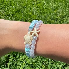 Here's my beachy blue turtle bracelet set! It comes with a blue + white bracelet with a turtle & a pearl + starfish bracelet! Hope you guys like it!! (Colors may be a bit different in real life) Adjustable Starfish Casual Bracelets, Casual Adjustable Starfish Bracelet, Casual Adjustable Starfish Bracelets, Adjustable Casual Bracelets With Starfish Charm, Casual Adjustable Bracelet With Starfish Charm, Casual Blue Beaded Bracelets With Starfish Charm, Casual Adjustable Bracelets With Starfish Charm, Casual Adjustable Starfish Beaded Bracelets, Casual Starfish Bracelets As Gift