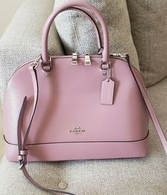 Coach Crossgrain Sierra Satchel Shoulder Handbag PINK Patent Crossgrain Leather Inside cell phone and multifunction pockets Zip closure, fabric lining Handles with 4 1/4" drop Outside slip pocket Detachable strap with 21 1/2" for shoulder or crossbody wear 13 1/2" (L) x 9 1/2" (H) x 4 3/4" (W) Style No. F31352 Like new. No tags. No notable flaws.  Msrp $428. Excellent condition. Gorgeous. Sold out in this color. No dustbag.smoke and pet free home. Guaranteed authentic. No lowball offers plse. Coach Sierra, Purse Aesthetic, Pink Handbags, Pink Purse, Cute Purses, Shoulder Handbag, Kate Spade Top Handle Bag, Dusty Pink, Aeropostale