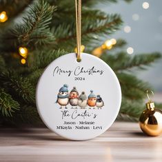 personalized christmas ornament with three birds on it next to a christmas tree