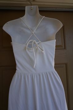 "Vintage ruched white dress. Estimated size small. In very good vintage condition - no flaws to note. Measurements taken across front lying flat 16\" across front armpit to armpit 13\" across front of waist 23\" across hips 58\" length" White Ruched Back Maxi Dress For Summer, White Maxi Dress With Spaghetti Straps, White Spaghetti Strap Maxi Dress, White Dress With Spaghetti Straps And Ruched Back, White Dresses With Knotted Spaghetti Straps, Fitted Maxi Dress With Knotted Spaghetti Straps, Fitted Maxi Dress With Spaghetti And Knotted Straps, White Dress With Knotted Spaghetti Straps, White Spaghetti Strap Dress With Ruched Back