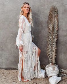 The Boho Lace Tulle Maxi Dress exudes romantic charm with its intricate lace detailing and flowing tulle fabric. Perfect for special occasions or outdoor weddings, it offers a bohemian-inspired elegance that combines grace with a touch of whimsy, ensuring a standout look.