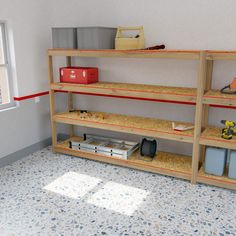 a room with shelves and tools on the floor