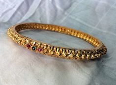 22K Gold fine handmade bangles set of 4 pieces. Inner diameter -6 cm (available in all sizes),widht-1cm, weight of four pieces-60 grams. Traditional 22k Gold Bangle For Ceremonial Occasions, Traditional 22k Gold Bangle For Ceremonial Use, Handmade 22k Gold Bangle, Traditional 22k Gold Bangle, Handmade Traditional 22k Gold Bangle, Traditional 22k Gold Ceremonial Bangle, Hallmarked 22k Gold Bangle For Festivals, Celebration Gold-plated Hand-set Bangle, Traditional Heavy Gold-plated Bangle