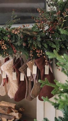 stockings hanging from the fireplace with tags on them