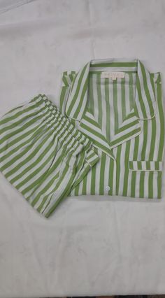 Lounge in style at home in this comfy cool Night suit set! You will definitely fall in love with this beautiful striped wear This piece is a set of two - shirt and shorts The shirt is front open with buttons and a pocket at one side and the shorts have a soft elastic with a string to tie according to the waist size The fabric is pre-washed before tailoring and hence is free from any chemicals and is extra soft and ready to wear. Material: Pure cotton Wash Care: Gentle hand wash. Wash in cold wat Striped Night Suit, Striped Summer Sleepwear, Striped Spring Sleepwear For Bedtime, Spring Striped Sleepwear For Bedtime, Casual Striped Sleepwear For Home, Striped Sleepwear For Spring Sleepover, Striped Summer Loungewear Sets, Striped Loungewear Sets For Summer, Striped Sets For Summer Loungewear