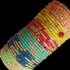 Classical Dance Jewelry Adjustable Multicolor Navratri Bracelets, Adjustable Multicolor Bracelets For Navratri, Traditional Adjustable Multicolor Bangle, Adjustable Yellow Bangle For Festivals, Adjustable Multicolor Bracelets For Diwali, Multicolor Handmade Bangle For Puja, Multicolor Bracelets For Navratri Celebration, Handmade Multicolor Bangle For Puja, Adjustable Bollywood Bangle For Navratri