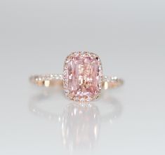 This ring features a 3.7ct radiant cut Peach color sapphire. The stone is unbelievable - natural non-treated sapphire, very soft and sparkling. The sapphire displays some color change under certain lightening - very intriguing and unique. This beauty is set in a 14k rose gold cushion diamond setting. I improved my signature setting and made it more sturdy with thicker gold part. It keeps the same delicate look as my other settings but is more practical for everyday wear. Hope you like it. Size 6 Pink Stone Gold Engagement Rings, Vintage Engagement Rings Pink Sapphire, Luxury Pink Rose Cut Diamond Wedding Ring, Padparadscha Sapphire Ring, Peach Sapphire Rings, Peach Sapphire Engagement Ring, Peach Sapphire, Pave Diamond Band, Padparadscha Sapphire