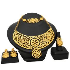 Indian Gold Plated Jewelry Sets Wedding Dubai Choker Necklace Bracelet Earring Ring Nigerian Bridal Set African JeweleryModel Number:1005003058985413 (1) Necklace approx :43cm +5cm. Bracelet approx :19.2cm .One set includes 1 Necklace,1 Bracelet,a pair of Stud Earrings and a Ring. (2) When you go to a banquet, necklace suit will match your dress very well, highlighting your temperament; when you go to a dance party, it will make you look more mature. (3) The jewelry set is packed with a box.Idea Elegant Metal Bridal Sets For Gift, Elegant Metal Bridal Sets As Gift, Wedding Jewelry With Metal Plating, Plated Alloy Wedding Jewelry, Wedding Alloy Plated Jewelry, Elegant Metal Jewelry For Anniversary, Plated Alloy Jewelry Sets For Wedding, Wedding Alloy Plated Jewelry Sets, Costume Jewelry Metal Bridal Sets