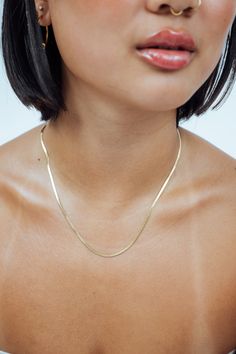 The Herringbone chain comes in 4 different sizes for a reason. They’re the most popular chains of all time because they work really well as an everyday necklace stack on its own and pairs well with any chain you want to layer. Finish: 14k gold Material: Stainless Steel*Tarnish Free* 16in + 2in Adjustable Herringbone Necklace Outfit, Faux Nose Ring, Necklace Stack, Bone Necklace, Herringbone Chain, Herringbone Necklace, Gold Chain With Pendant, 2024 Christmas, Rose Gold Chain