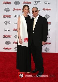 an older man and woman are standing on the red carpet at avengers's world premiere