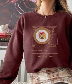 "Introducing The Marauders sweatshirt, a must-have addition to the wardrobe of any fan of the fanfic \"All The Young Dudes.\" This sweatshirt features a 70s retro vintage aesthetic design, showcasing the iconic group known as The Marauders. A sturdy and warm sweatshirt bound to keep you warm in the colder months. A pre-shrunk, classic fit sweater that's made with air-jet spun yarn for a soft feel and reduced pilling. * 50% cotton, 50% polyester * Pre-shrunk * Classic fit * 1x1 athletic rib knit collar with spandex * Air-jet spun yarn with a soft feel and reduced pilling * Double-needle stitched collar, shoulders, armholes, cuffs, and hem" Retro Graphic Print Sweatshirt For Fans, Retro Crew Neck Sweatshirt For Fan Merchandise, Fall Pop Culture Fan Merchandise Sweatshirt, Pop Culture Fan Merchandise Sweatshirt For Fall, Retro Fall Fan Merchandise Sweatshirt, Trendy Crew Neck Sweatshirt For Fan Merchandise, Vintage Aesthetic Design, Retro 70s Aesthetic, Retro Vintage Aesthetic