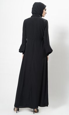 Featuring a casual everyday shirt style abaya dress in nida base with hidden overlapping button closure placket at the centre front. Its a simple muslimah abaya with bishop style sleeves and A line silhouette perfect to be worn daily for informal ocassions.FIT : Relaxed fit.COMPOSITION : Nida.CARE : Dry clean only. Long Sleeve Modest Abaya With Modesty Panel, Modest Long Sleeve Abaya With Modesty Panel, Long Sleeve Abaya With Modesty Panel For Fall, Fall Long Sleeve Abaya With Modesty Panel, Modest Maxi Length Abaya For Fall, Fall Modest Maxi Length Abaya, Fall Season Modest Maxi Length Abaya, Modest Long Sleeve Maxi Dress With Buttons, Maxi Length Abaya For Fall Workwear