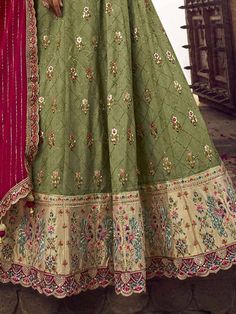 Be an angel and create and establish a smashing influence on every person by wearing this excellent teal green color lehenga made of viscose silk material adorned with embroidery work, sequin work, and a beautiful peacock motif. This gorgeous teal green lehenga comes with a pink color blouse of viscose silk material designed with embroidery and sequin work. It also comes with a a pink color bamberg silk material dupatta crafted with gorgeous lace border work. This teal-green traditional lehenga Designer Green Art Silk Sharara, Green Embroidered Raw Silk Sharara, Designer Embroidered Green Sharara, Green Meenakari Sharara, Designer Green Sharara With Intricate Embroidery, Semi-stitched Green Sharara With Zari Work, Green Embroidered Raw Silk Anarkali Set, Semi-stitched Green Choli For Eid, Green Embroidered Anarkali Set In Raw Silk