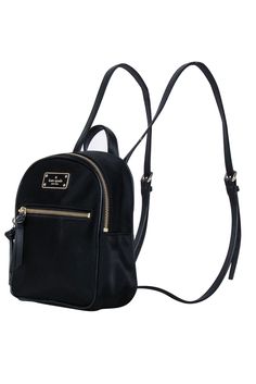 Be ready for any adventure with the Kate Spade black nylon mini backpack. Perfect for a weekend getaway, this backpack stores all your essentials in style. From hiking to picnics, it's a must-have for any fun-filled excursion. 100% Nylon Fabric lining Logo plaque front Top zipper closure Front exterior zipper pocket Adjustable straps Height 8.25" Width 6.5" Depth 3.5" Trendy Kate Spade Standard Backpack, Trendy Kate Spade Backpack, Casual Nylon Kate Spade Bag, Backpack For Weekend Trips, Backpack For Weekend Trips And Back To School, Kate Spade Nylon Backpack For Everyday Use, Kate Spade Nylon Backpack For Everyday, Kate Spade Backpack With Zipper Closure, Kate Spade Nylon Bag With Zipper Closure