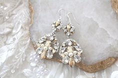 Long Chandelier Vintage style bridal earrings created with Golden Shadow and clear crystals. An amazing pair of earrings for any bride looking for statement jewelry with lots of sparkle ! - Handcrafted with Premium European crystals and pearls - Each stone is set by hand in my studio- golden shadow, clear stones and Crystal pearls- Hair comb measures 2.75" x 1.25"- Handcrafted in the US. This is an original design by © Treasures by AgnesPLEASE ALLOW APPROX 10 BUSINESS DAYS FOR COMPLETION BEFORE Wedding Earrings Chandelier, Earrings For Bride, Bridal Jewellery Earrings, Chandelier Vintage, Long Chandelier, Vintage Wedding Jewelry, Golden Shadow, Gold Earrings Wedding, Rose Gold Earrings Studs