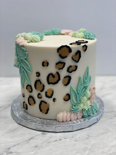 a white cake with leopard print on it