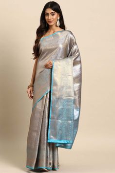 Beautiful saree is embellished with kota zari is from Silk Land on Karma Place, copper zari as well, it's lightweight saree along with easy to carry, must have in the wardrobe. Saree has a heavy zari thread for that it's giving a rich look while wearing. Have a contrast border and unstiched blouse piece. You can pair this saree with heels and minimal jewellery for party look.Product Features: Saree Color: Blue Saree Fabric: Tissue Blouse Fabric: Tissue Work: Woven Pattern: Floral Occasion: Festi Traditional Silver Tissue Silk Pre-draped Saree, Festive Celebration Pre-draped Saree With Zari Weaving, Semi-stitched Silver Pre-draped Saree, Celebration Chanderi Saree With Zari Weaving, Designer Silver Saree, Celebration Tissue Silk Saree With Zari Weaving, Diwali Celebration Paithani Silk Pre-draped Saree, Traditional Silver Pre-draped Saree For Eid, Diwali Celebration Tissue Silk Saree