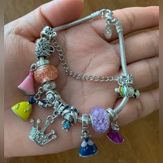 Pandora Moments Bracelet With Beautiful Colorful Disney Princess Theme Charms 925 Sterling Silver Pandora Bracelet. Bracelet Is Authentic Pandora. Charms Are Non Brand Charms, All Brand New. Bracelet Is In Great Condition. Every Charms Are Brand New! You’ll Get Everything In Pictures. Very Pretty Bracelet Set. Perfect For Disney Fan! Please Review All Photos Carefully. Romantic Silver Plate Princess Skirt Crown Pendant Charm Bracelet Suitable For Women Princess Beads Fine Bracelet Brand Gifts Themed Silver Jewelry For Disney Fan Events, Silver Disney Charm Bracelet As A Gift, Silver Disney Charm Bracelet Gift, Silver Disney Bracelet For Gift, Silver Disney Bracelet As Gift, Disney Silver Bracelet Gift, Disney Silver Bracelet For A Gift, Disney Multicolor Jewelry Gift, Disney Silver Jewelry With Charms