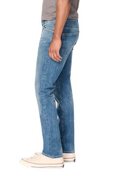 A distressed medium wash renders a laid-back vibe in a pair of slim-fit jeans that effortlessly retain their shape while also offering stretch. Zip fly with button closure Five-pocket style 92% cotton, 7% polyester, 1% Lycra® spandex Machine wash, dry flat Imported Fitted Distressed Jeans For Everyday Wear, Everyday Fitted Distressed Jeans, Distressed Fitted Medium Wash Jeans, Classic Slim Fit Light Wash Jeans, Classic Light Wash Slim Fit Jeans, Medium Wash Slim Straight Fit Jeans, Distressed Fitted Jeans In Medium Wash, Slim Straight Fit Medium Wash Jeans, Classic Fitted Washed Jeans