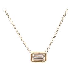 This beautiful diamond necklace is a great piece to start your jewelry collection. Encased in 14k yellow gold, the diamond boasts a color or G/H and VS2 in clarity. A great piece to add to any wardrobe. Classic 14k Gold Necklace With Emerald Cut, Timeless 14k Gold Emerald-cut Necklace, Luxury Diamond Necklace With Vvs Clarity And Emerald Cut, Luxury Emerald Cut Diamond Necklace With Vvs Clarity, Luxury Emerald-cut Diamond Necklace With Vvs Clarity, Yellow Gold Baguette Cut Cubic Zirconia Necklace, 14k Gold Emerald Cut Fine Jewelry Necklace, Classic Diamond White Baguette Cut Necklace, White Gold Baguette Cut Single Diamond Necklace