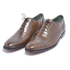 If you’ve been thinking which lace shoes to invest in, then look no further. These brown oxford capped toe brogue genuine leather shoes are more splendid than you ever imagined! The vamp covers the instep and toes, whereas the quarter wraps around the heel and joins the vamp in the middle of the foot. When it comes to versatility, elegance, and quality, you can never go wrong with these brown oxford capped toe brogue genuine leather shoes. Following are their features; Made of high-quality leather Capped toe with brogue design Oxford style handmade When it comes to style and quality, we guarantee you a great blend of both with this winning pair. Brown Lace-up Brogue Shoes With Cap Toe, Brown Cap Toe Lace-up Shoes With Goodyear Welt, Leather Oxfords With Leather Sole For Derby, Brown Cap Toe Goodyear Welted Lace-up Shoes, Classic Oxford Lace-up Shoes With Rubber Heel Cap, Oxford Leather Wingtip Shoes With Laces, Wingtip Leather Oxford Shoes With Laces, Brown Goodyear Welted Cap Toe Lace-up Shoes, Classic Brogue Lace-up Shoes For Galas