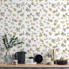 the wallpaper is decorated with fruit and leaves