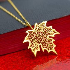 Gold Maple Leaf Necklace, 24k Gold Vermeil Style Leaf Pendant & Gold Filled Chain, Botanical Tree Leaf Jewelry, Filigree Leaf, Autumn Gift, FREE SHIPPING Add a touch of nature to your look with this elegant and detailed 24 karat gold Vermeil style maple leaf pendant necklace. The gold maple leaf can be matched with your choice of 14 karat gold filled chain. What is Vermeil Style? Gold vermeil jewelry refers to gold plated over 925 sterling silver. To be considered Vermeil the gold layer must be Leaf-shaped Yellow Gold Necklace, Leaf-shaped Yellow Gold Necklace For Gift, Leaf-shaped Yellow Gold Plated Jewelry, Yellow Gold Plated Leaf-shaped Jewelry, Yellow Gold Leaf-shaped Jewelry Gift, Yellow Gold Leaf Necklace As Gift, Yellow Gold Leaf Necklace For Gift, Gold Leaf-shaped Jewelry Gift, Gold Plated Leaf-shaped Jewelry