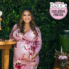 Our best-selling wrap dress is now available in the most perfect pink floral print for spring. Features high quality stretch fabric and 3/4 sleeves. Worn by pregnant, nursing, and postpartum mamas! As worn by "On Air with Ryan Seacrest" co-host, Sisanie, featured in People magazine. Color: Mauve Appearance of a wrap-dress, with out having to tie to close 95% Polyester, 5% Spandex Maternity, Postpartum & Nursing-Friendly Length measured from bustline to floor. S (0-4): Bust 33-36", Length 43" Pink Baby Shower Dress, Gender Reveal Dress, Maternity Stores, Stylish Maternity Dress, Ryan Seacrest, Maternity Maxi, Baby Shower Dresses, Mama Style, Nursing Friendly