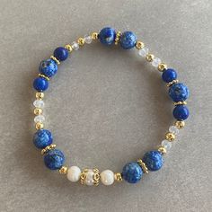 Lapis Lazuli Gemstone and White Pearl Bracelet Arrives ready for gifting and usually ships same day or next day. The necklace will be sent with a gift! O T H E R ∙ I N F O R M A T I O N Lapis Lazuli size: 8 mm Lapis Lazuli size: 6 mm Pearl size: 5-6 mm Crystal size: 3 mm **Intermediate apparatus and beads are non-tarnish gold plated. ☆ Each of our bracelets at PEARLOWNJEWELRY are handmade and special natural stones. Bracelet and necklace are made with positive energy. Each crystal is cleaned bef Spiritual Lapis Lazuli Beaded Gift Bracelets, Blue Hand-strung Pearl Bracelet With Round Beads, Adjustable Lapis Lazuli Beaded Bracelet With Faceted Beads, Blue Pearl Bracelet With Natural Stones, Adjustable Blue Pearl Bracelet With Natural Stones, Blue Pearl Bracelet With Natural Round Beads, Blue Bracelet With Faceted Beads For Gift, Blue Faceted Beads Bracelet For Gift, Blue Bracelets With Faceted Beads As A Gift