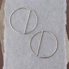 • Sterling Silver Geometric Hoop Earrings -- silver circles with a vertical dividing line, super minimalist and easy to wear• READY TO SHIP • Just over one inch long and wide Minimalist Metal Open Circle Earrings, Minimalist Open Circle Metal Earrings, Minimalist Silver Metal Threader Earrings, Minimalist Metal Pierced Wrap Earrings, Minimalist Metal Threader Earrings, Minimalist Metal Wrap Earrings, Minimalist Metal Hoop Wrap Earrings, Minimalist Sterling Silver Round Threader Earrings, Minimalist Metal Cartilage Earrings With Ear Wire