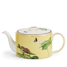 a tea pot with a bird on it