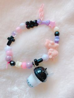 You'll get 1 bracelet. Handmade by me. :) the bracelet its made with a stretchable cord. Very sturdy and cute. Pastel Goth Bracelets, Pink Beaded Kawaii Bracelets, Kawaii Pink Beaded Bracelets, Pink Adjustable Kawaii Beaded Bracelets, Kawaii Adjustable Pink Beaded Bracelet, Adjustable Pink Beaded Bracelets In Kawaii Style, Adjustable Pink Beaded Bracelet In Kawaii Style, Adjustable Pink Kawaii Charm Bracelet, Cute Beaded Charm Bracelet