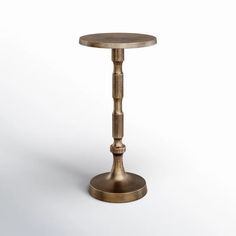 a small round table with a metal base on a white background in the shape of a column