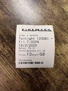 a ticket for a movie is sitting on the table