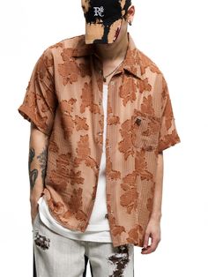 This is a casual and unique shirt with short sleeves that is made out of high quality polyester 100% fabric. With design detail of light fabric with flower pattern and oversized silhouette, it gives a comfortable and trendy mood.- RSCC Logo metal emblem on the chest- Light fabric with flower pattern- Rough fringe detail- Logo engraved buttons detail Oversized Half Sleeve Summer Shirt, Patterned Short Sleeve Shirt For Spring, Casual Brown Hawaiian Shirt For Summer, Casual Short Sleeve Shirt With Floral Print, Oversized Brown Shirt For Spring, Trendy Relaxed Fit Hawaiian Shirt With Short Sleeves, Trendy Relaxed Fit Short Sleeve Hawaiian Shirt, Relaxed Fit Floral Print Shirt With Short Sleeves, Brown Relaxed Fit Shirt For Summer