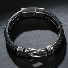 Bold and unique, this bracelet makes an adorable gift for people who are looking for a men's bracelet. Crafted in titanium steel, the bracelet shows a unique and pristine look. Just take this handsome design. It won't disappoint you! Material: Titanium SteelPlating Color: Silver Elegant Silver Stainless Steel Wristband, Modern Braided Bracelets With Stainless Steel Clasp, Modern Braided Bracelet With Stainless Steel Clasp, Modern Metal Wristband As Gift, Modern Metal Wristband Gift, Classic Gunmetal Stainless Steel Bracelets, Classic Stainless Steel Bracelets In Gunmetal, Silver Minimalist Leather Bracelet, Modern Metal Braided Bracelets With Stainless Steel Clasp