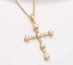 Set with dewy cultured freshwater pearls and a flash of sparkle, this cross necklace is a gorgeous tribute to the belief system you rely on -- and an elevated accessory for all the season's celebrations. Elegant Pearl Cross Pendant Jewelry, Elegant Cross-shaped Pearl Necklace For Wedding, Gold Pearl Cross Pendant Jewelry, Elegant Cross-shaped Pearl Necklace, Elegant Cross-shaped Pearl Pendant Jewelry, Pearl Cross Necklace, Bird Tattoos For Women, Belief System, Bird Tattoos