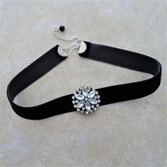 "A black velvet ribbon choker is accented with a lovely sliding flower rhinestone focal.  The ribbon is crimped with silver crimp bars with a silver chain for adjustable sizing from 13 \" - 15\". There is a wire wrapped black bead dangle linked on the chain.  The ribbon is 5/8\" wide and there is a silver hook closure on the choker.  All of my jewelry items come boxed, and ribbon tied and tagged for easy gifting." Black Velvet Choker Necklace, Black Velvet Ribbon, Velvet Choker Necklaces, Ribbon Choker, Choker Black, Black Velvet Choker, Choker Style Necklace, Flower Choker, Velvet Choker