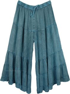 A relaxed pair of long dull stonewashed teal palazzo pants for the summer season. The huge flare gives it a feminine yet cool bohemian look, almost looks like a skirt with divided legs. You can mix and match the styles and wear them with tops of different colors. It has an elastic waistband and drawstrings for extra comfort. These casual summer day pants will go with every style and fashion. You can wear them with flats or heels. You can wear jewelry and accessorize yourself. The fabric is light Stonewashed Relaxed Fit Bottoms For Spring, Casual Stonewashed Wide-leg Bottoms, Casual Stonewashed Wide Leg Bottoms, Indigo Cotton Pants For Summer, Summer Indigo Cotton Pants, Bohemian Denim Blue Cotton Pants, Bohemian Style Denim Blue Cotton Pants, Summer Cotton Pants In Indigo, Casual Stonewashed Bottoms For Summer