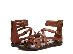 Sam Edelman Gibbs - Women's Shoes : Rich Cognac : Buckle up the Sam Edelman Gibbs sandals for a strappy style moment. Leather upper. Synthetic lining. TPR footbed. Zippered back with buckle closure. Ankle-length flat sandal. Round toe silhouette. Synthetic outsole. Imported. Measurements: Heel Height: 1 2 in Product measurements were taken using size 7, width M. Please note that measurements may vary by size. Weight of footwear is based on a single item, not a pair. Trendy Strapped Sandals For Summer, Summer Strappy T-strap Sandals With Buckle Closure, Spring Open Toe T-strap Sandals With Strap, Brown Strapped Sandals For Summer, Flat T-strap Sandals With Adjustable Strap For Spring, Trendy Open Toe Sandals With Straps, Trendy Strappy Sandals With Adjustable Straps, Brown Strap Sandals For Summer, Brown Strap Sandals For Spring