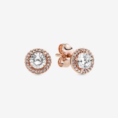 When you want classic elegance and a dose of drama, reach for these Round Sparkle Halo Stud Earrings. With a distinctly vintage feel, the 14k rose gold-plated, hand-finished pieces are centred with a brilliant cubic zirconia that is surrounded by a halo of smaller stones. The earrings work with everything, day or night. Try styling them with the corresponding pendant necklace, inspired by antique jewellery box treasures. - Pandora Round Sparkle Halo Stud Earrings - 14k Rose gold-plated unique metal blend / Cubic Zirconia / Clear Pandora Earrings Studs, Pandora Earrings, Pandora Rose, Antique Jewelry Box, Halo Stud Earrings, Halo Earrings Studs, Earring Studs, Antique Jewellery, Pandora Jewelry