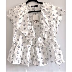 New With Tags. Short Sleeve Blouse With V-Neck Wrap Neckline. Side Wrap Ties For Adjustment. Eyelet And Ruffle Detail. White And Blue. Peplum Wrap Top, Zara White, White Eyelet, Neck Wrap, Wrap Top, Zara Tops, Short Sleeve Blouse, Sleeve Blouse, Blue White