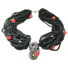 Simply Beautiful Designer Multi Strand Black Onyx and Coral Beads Necklace, suspending a Silver Dragon holding a securely set Coral stone. Seahorse logo on clasp and reverse marked SILVER. Silver tone mountings. Necklace measures approx. 20" in length. Chic and Fabulous…Sure to be admired perfect accessory for the modern woman! Luxury Beaded Onyx Jewelry, Luxury Black Beads Jewelry For Formal Occasions, Formal Multi-strand Black Beaded Necklaces, Luxury Onyx Beaded Jewelry, Formal Multi-strand Black Beaded Necklace, Luxury Formal Jewelry With Black Beads, Formal Black Multi-strand Beaded Necklaces, Formal Black Multi-strand Beaded Necklace, Luxury Onyx Jewelry With Black Beads