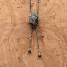 "This design is a success in so many ways. We love the traditional western bolo tie, but we wanted a more feminine version of it. We've used traditional southwestern silversmithing using .925 twist wire accents -- oxidized, sanded and polished. This necklace closes in the back with a clasp like any necklace and uses an ultra-comfortable .925 Sterling Silver rope chain -- the sterling silver chain \"tips\" (hematite) are an added bonus, and really add a lot. An LBJ original! The Mock Bolo. featur Bolo Tie Necklace, Western Bolo Tie, Bolo Necklace, Silver Rope Chain, Tie Necklace, Stone Choker, Award Ceremony, Jasper Necklace, Fossil Coral