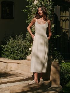 With a silhouette that’s equally flattering and elevated, the Rove Dress is designed to breathe new life into any summer ensemble. Fitted bust with pencil-skirt that hits below the calf, the Rove Dress is destined to be a spring & summer staple. Lined Midi Slip Dress With Fitted Bodice, Beige Pleated Midi Dress, Lined Linen Spring Dresses, Flowy Midi Dress With Straight Neckline For Summer, Summer Silk Dress For Work, Chic Beige Midi Dress With Pleated Bodice, Feminine A-line Slip Dress For Summer, A-line Sundress Slip Dress For Brunch, Chic Cream Silk Midi Dress