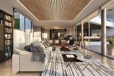 a living room filled with lots of furniture and bookshelves next to a large window