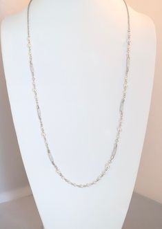 This beautiful necklace is made of sterling silver and freshwater pearls. It's a classic design that will never go out of style. Elegant Silver Chain Layered Necklace, Formal Double Strand Metal Necklace, Elegant Necklaces With Silver Chain, Elegant Necklace With Silver Chain, Long Single Strand Costume Jewelry Necklace, Silver Double Strand Necklaces With Delicate Chain, Classic Silver Double Strand Necklace, Long Necklace For Wedding, Long Silver Chain Necklace