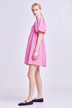 A summertime must-have, this Gingham Linen Sweetheart Baby Doll is as comfortable as it is chic. With its textured fabric, gingham print and sweetheart neckline, this mini dress is perfect for a day spent exploring the city or relaxing on the beach. The short puff sleeves and side pockets add a touch of femininity and functionality, while the lining ensures a perfect fit. For best results, hand wash cold and iron low. Textured Gingham Sweetheart neckline Short puff sleeves Mini length Side pockets Lining Shell: 50% Polyester 50% Cotton Lining: 80% Polyester 20% Cotton HN334D Total length: 35.50" Bust: 33.75" S POWDER BLUE: Height 5'8.5" / Bust 32" / Waist 24" / Hip 34" PINK: Height 5'10" / Bust 32" / Waist 24" / Hip 35" Cute Plaid Mini Dress For Spring, Cute Gingham Plaid Dress For Day Out, Preppy Mini Dress For Summer, Cute Gingham Dresses For Day Out, Cotton Plaid Mini Dress For Day Out, Gingham Cotton Mini Dress For Beach, Gingham Cotton Mini Dress For The Beach, Cute Summer Plaid Mini Dress, Cute Pink Plaid Dress For Spring